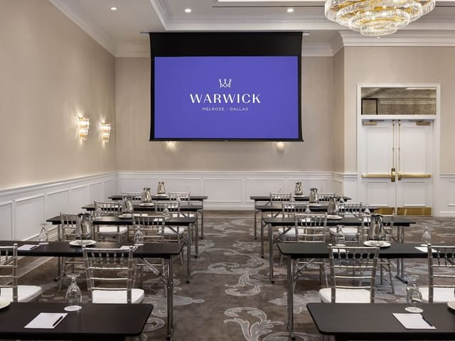 Ballroom in Warwick NY: Classroom-style corporate training setup with projection screen.