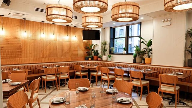 Sophisticated NYC conference room with plush seating, ideal for corporate dinners and networking.