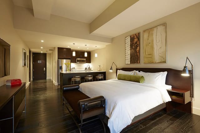 Luxury executive suite with kitchenette, ideal for corporate housing and VIP event accommodation.