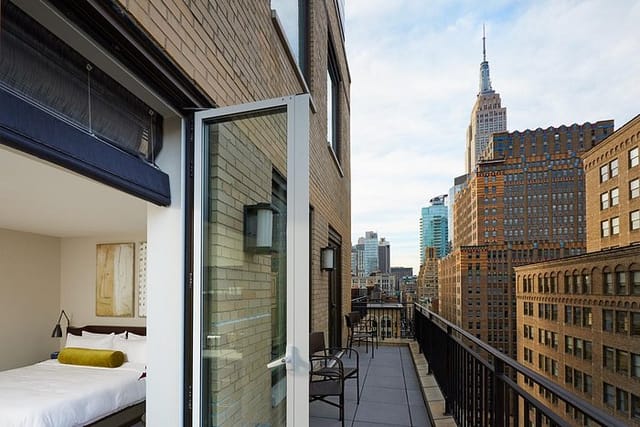 Luxury hotel suite with city views for VIP networking and executive bleisure events.