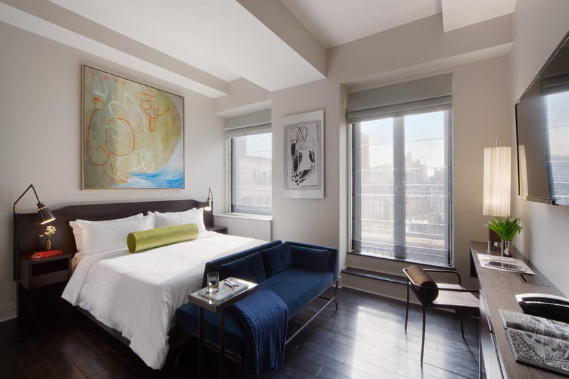 Luxury hotel suite with dedicated workspace for corporate travel and executive meetings.