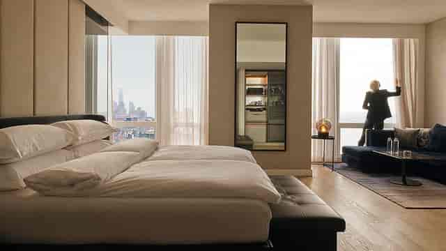 Equinox Hotel luxury executive suite with skyline view for VIP hospitality and speaker events.