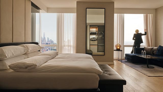 Equinox Hotel luxury executive suite with skyline view for VIP hospitality and speaker events.