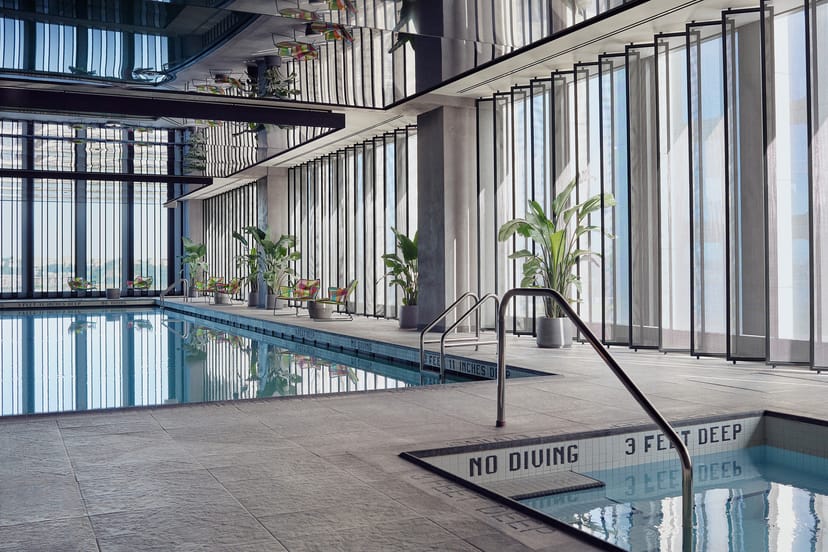 Luxury indoor pool at Equinox Hotel for corporate retreats and executive wellness travel.