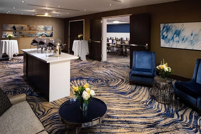 Hilton Brooklyn pre-function area with buffet and lounge for corporate meetings and event catering.