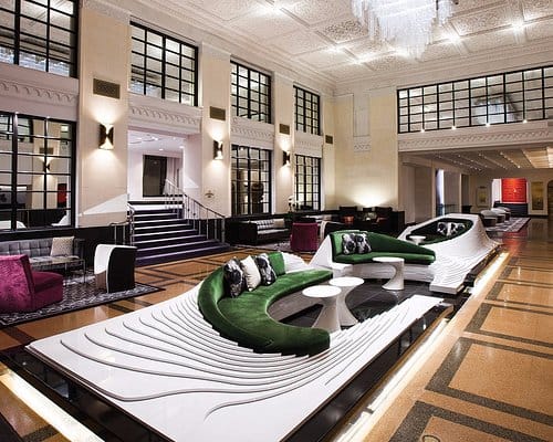 Luxury hotel lobby with versatile seating for upscale corporate networking and event registration.
