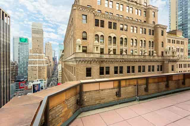 Rooftop suite at Stewart Hotel with Manhattan skyline views for VIP networking and evening events.