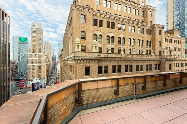 Rooftop suite at Stewart Hotel with Manhattan skyline views for VIP networking and evening events.