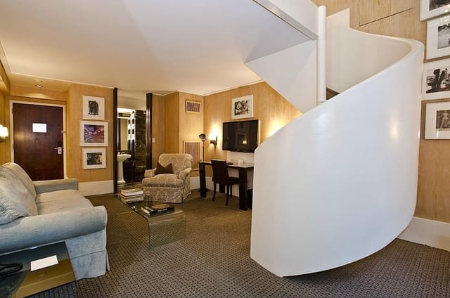 Bi-level City Club Hotel suite with executive workspace, ideal for corporate events and meetings.