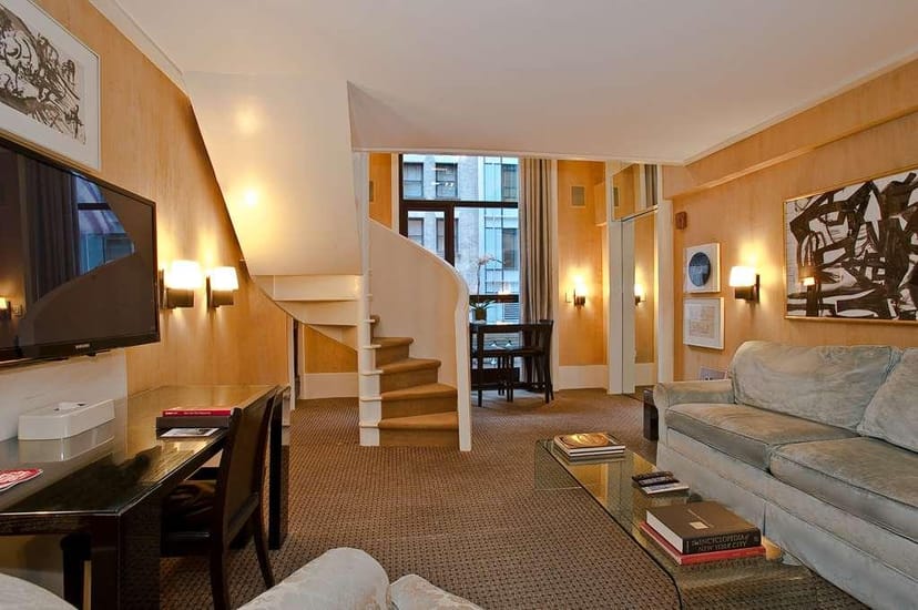 Split-level hotel suite in City Club Hotel for executive travel and boutique corporate meetings.