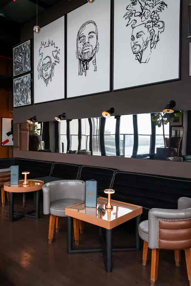 Sophisticated Hotel Hugo lounge with velvet banquettes for VIP receptions and networking events.