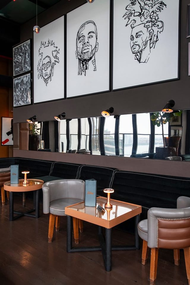 Sophisticated Hotel Hugo lounge with velvet banquettes for VIP receptions and networking events.