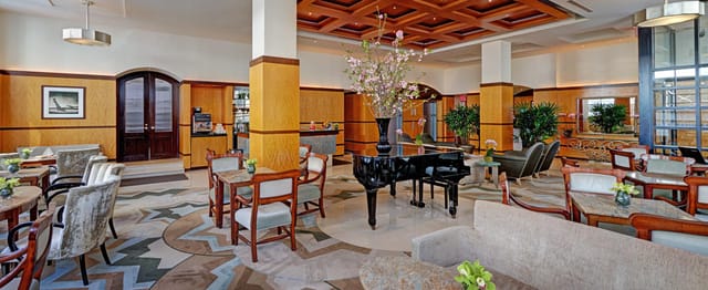 Grand Lobby at Hotel Giraffe: elegant pre-function networking space for VIP corporate events.