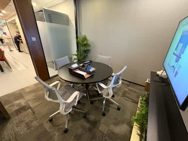 Compact meeting room 11C at Marina Bay Financial Centre, 4-seat setup for corporate collaboration.
