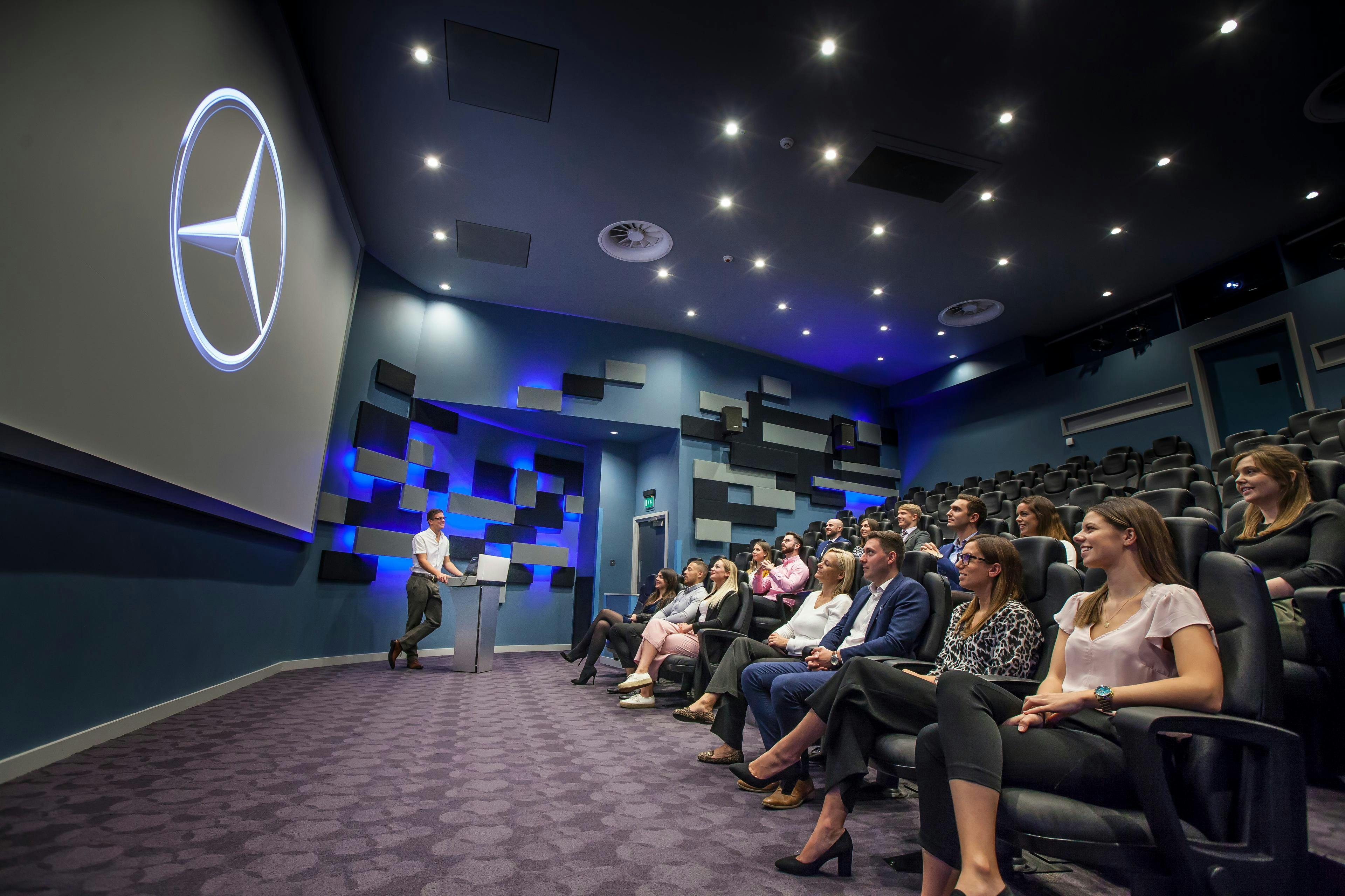 Modern conference room at Mercedes-Benz World for corporate presentations and training.