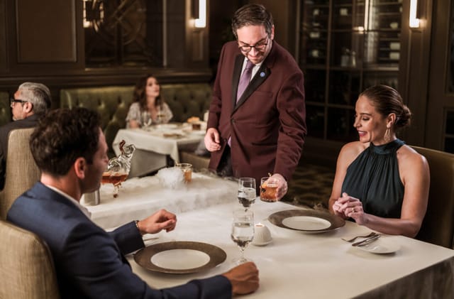 Upscale private dining room at Bull & Bear for corporate incentive dinners and client events.