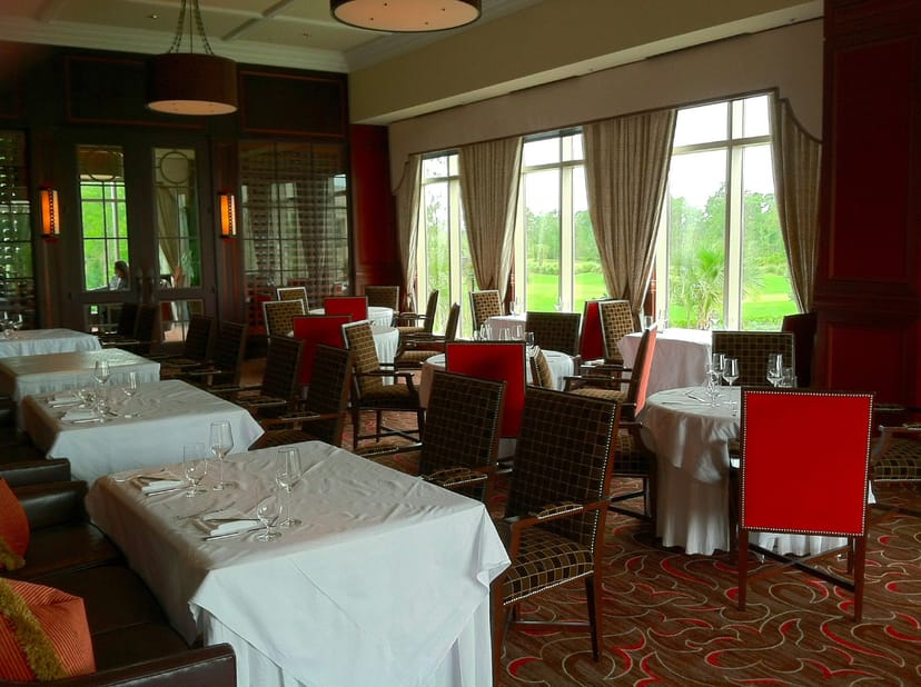 Private Dining Room at Bull & Bear with floor-to-ceiling windows for formal event hosting.