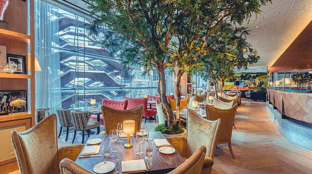 High-end Queensyard restaurant with biophilic decor for executive dinners and networking events.