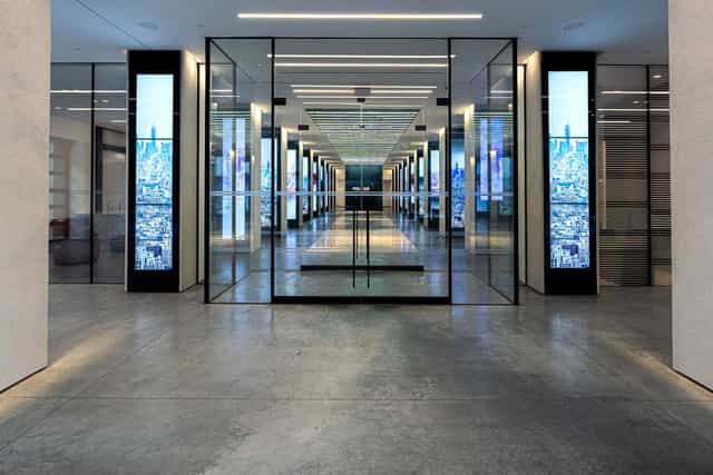 Modern Moonlight Studios NYC event entrance with digital signage pillars for corporate events.