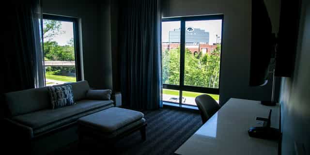 Kinnick + Carver guest room at The Heights Rooftop with workspace, ideal for corporate conferences.