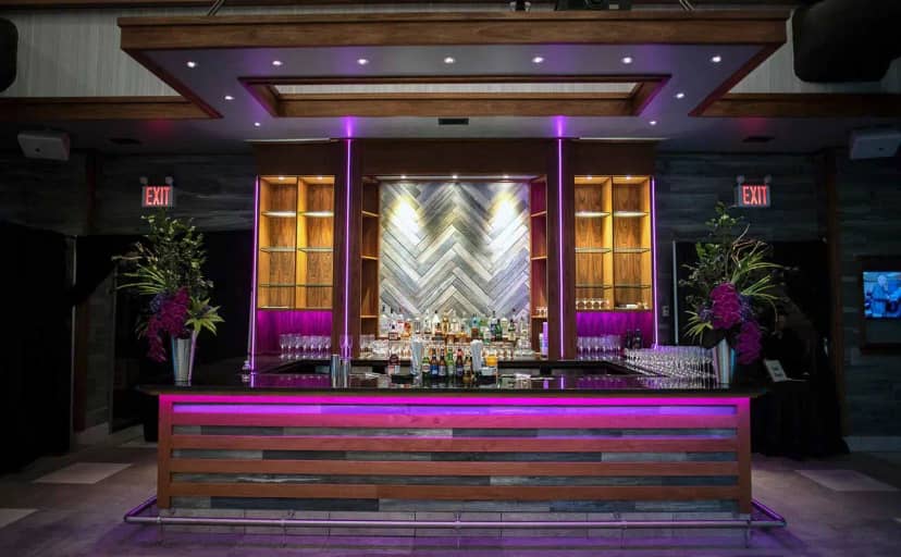 Modern bar installation with LED lighting for corporate gala and evening reception.