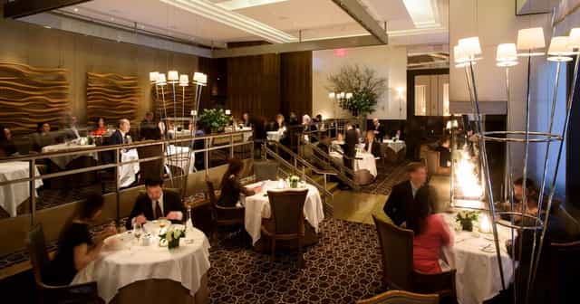 Per Se private dining room with tiered seating for corporate dinners and networking events.