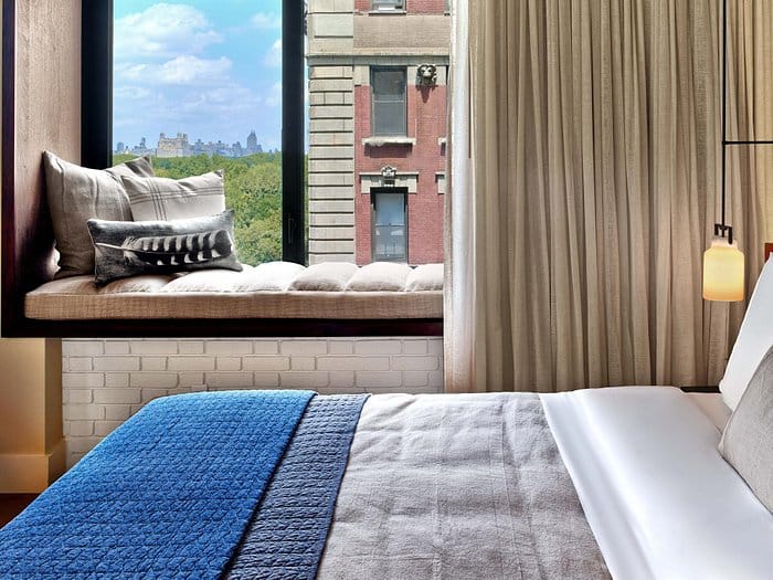 Luxury 1 Hotel Central Park suite with window nook for VIP board meetings and executive events.