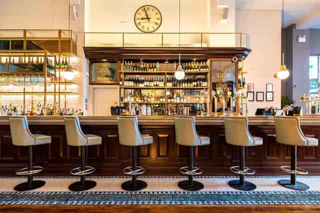 Private dining room with classic bar, perfect for VIP receptions and corporate networking events.