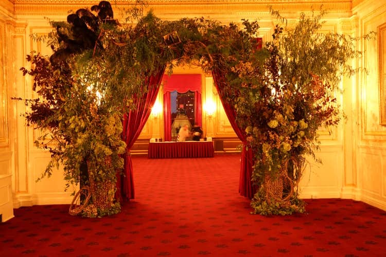 Oversized floral entrance at Metropolitan Club for red-carpet event venue reveal.