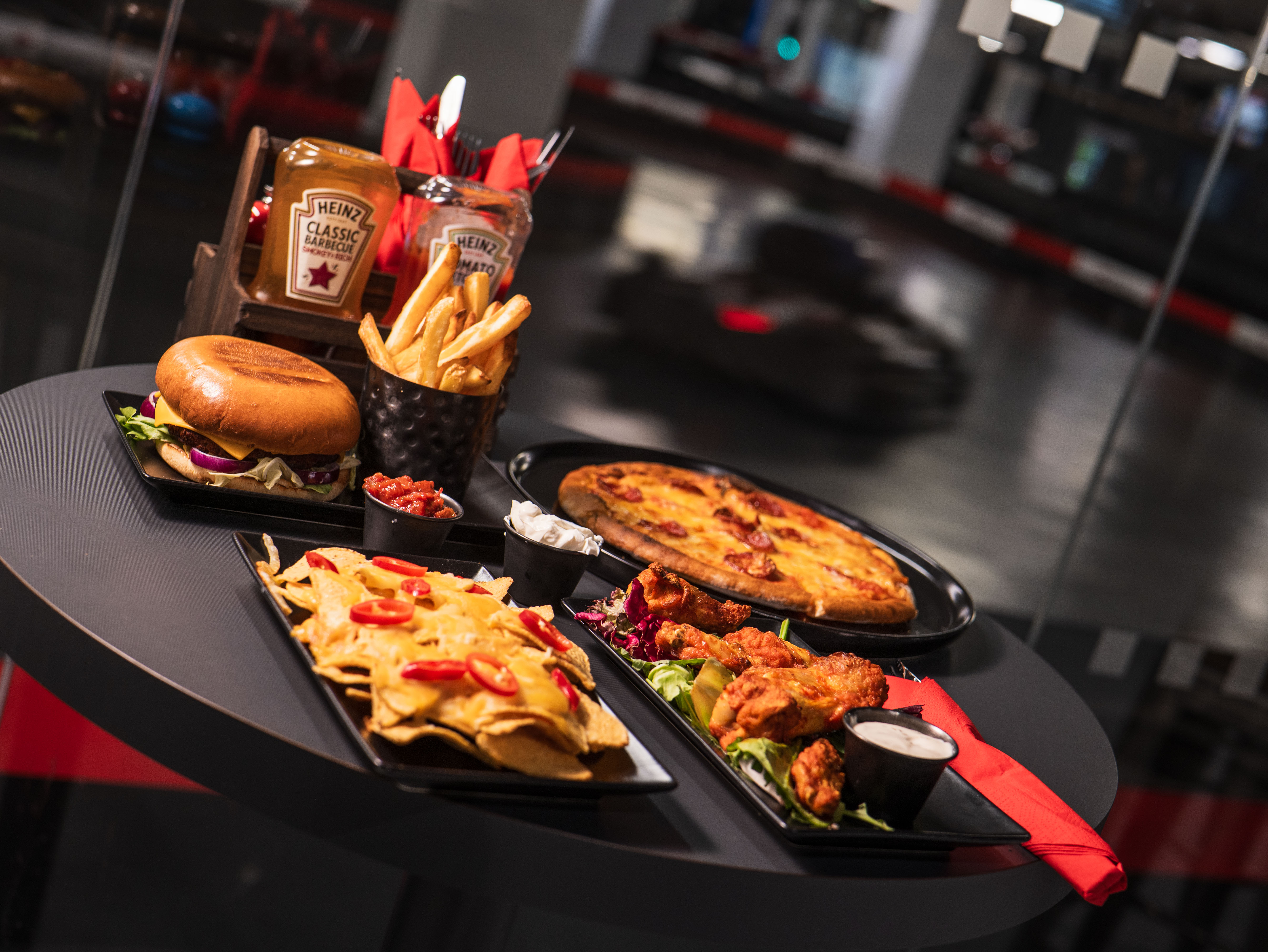 Indoor karting dining options at K1 Speed Canary Wharf for corporate events and team-building. - Banner