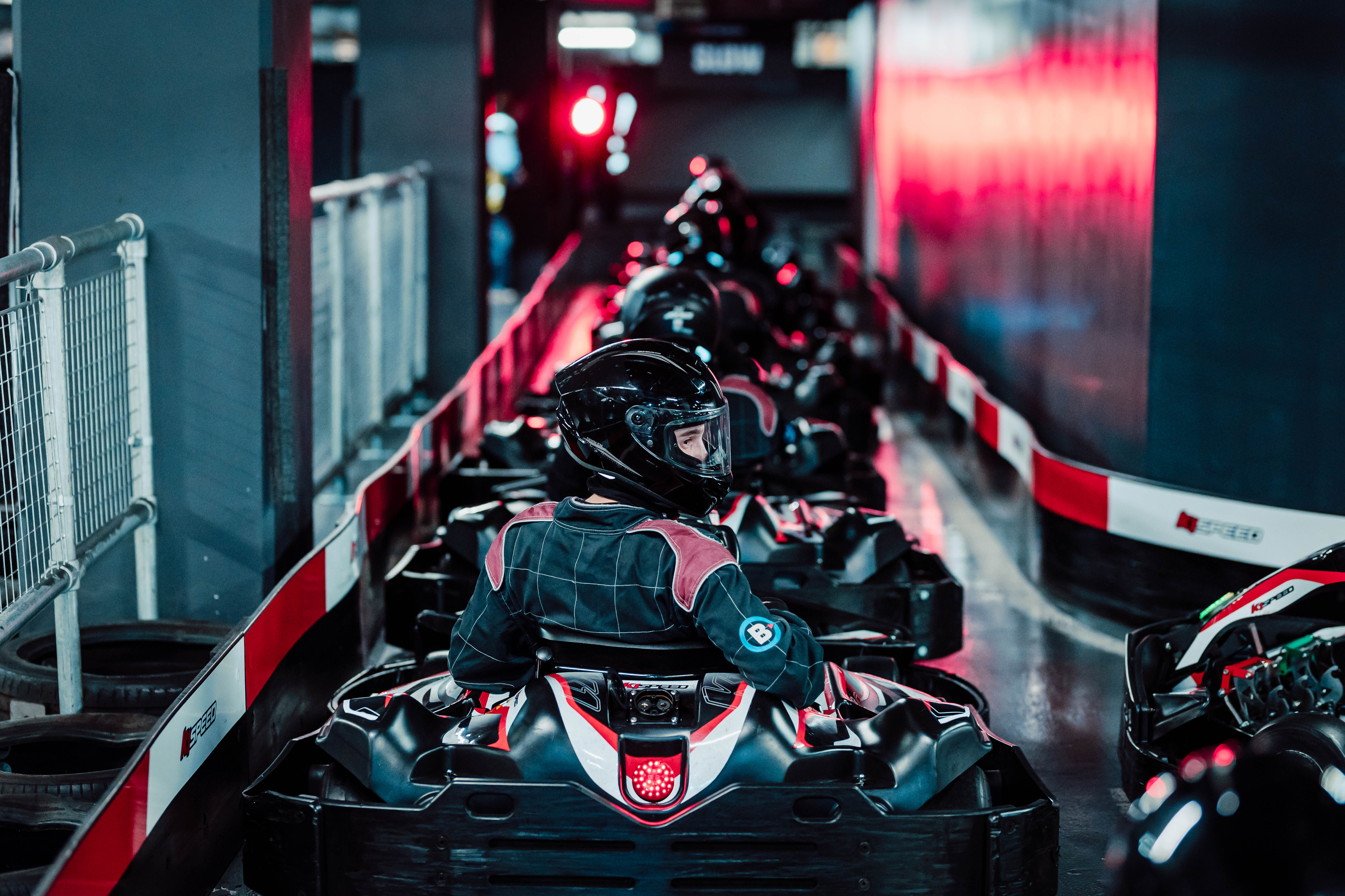 Indoor karting track at K1 Speed Canary Wharf for corporate events and team-building fun. - Banner