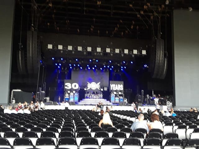 Outdoor stage at Toyota Music Factory for 30th anniversary corporate event and theater seating.