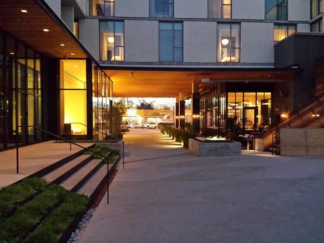 Modern hotel courtyard with ambient lighting for boutique outdoor evening receptions.
