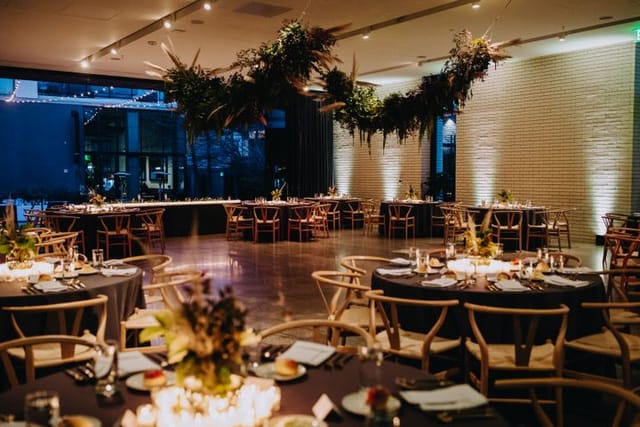 Modern event space at South Congress Hotel with floral ceiling decor for weddings and galas.
