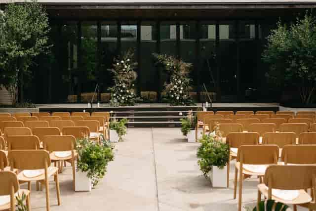 Modern outdoor wedding ceremony at The Studio, South Congress Hotel with minimalist wooden decor.