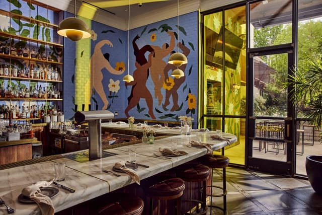 South Congress Hotel Boardroom with mural: ideal for high-end networking and corporate events.