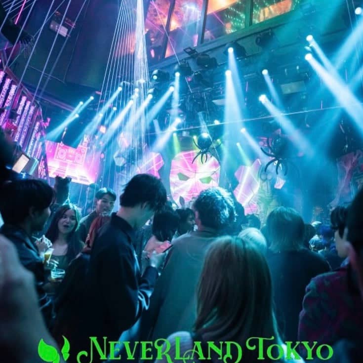 Spider-themed nightclub event with atmospheric lighting at Club Neverland Tokyo, nightlife party.