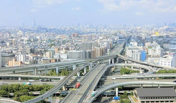 Shinden Riviera Tokyo multi-level highway interchange for event site selection and accessibility.
