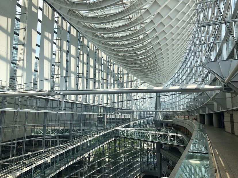 Tokyo International Forum lounge: modern convention venue for grand plenaries and networking.