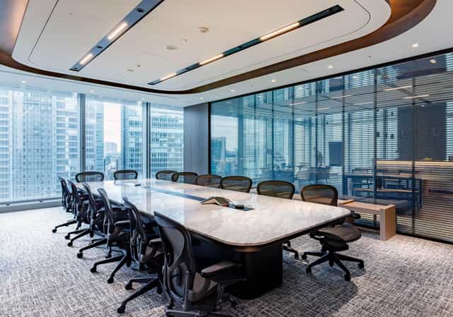 Executive boardroom at JP Tower Hall with marble table for corporate meetings and conferences.