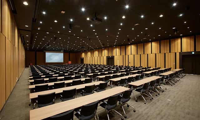 Modern conference hall with wood paneling for professional seminars and corporate training events.
