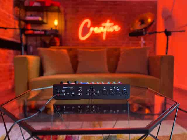Creators House podcast studio with professional audio gear for intimate content creation.