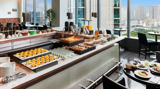 High-end Park Hotel Tokyo restaurant buffet with skyline view for executive meetings.
