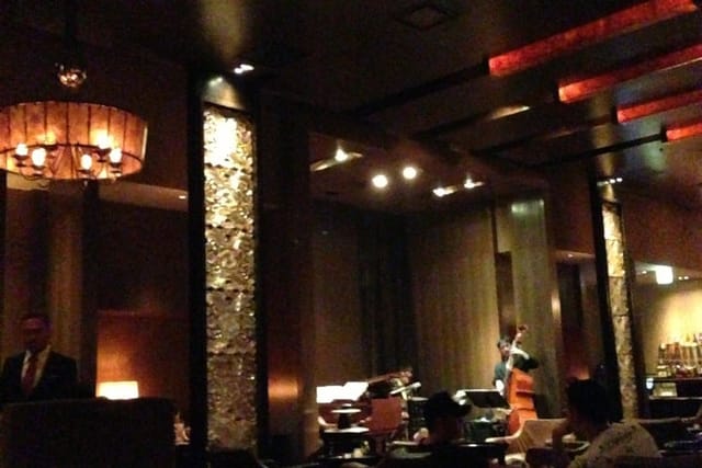 Luxury Maduro Bar lounge with warm lighting, perfect for VIP receptions and networking events.