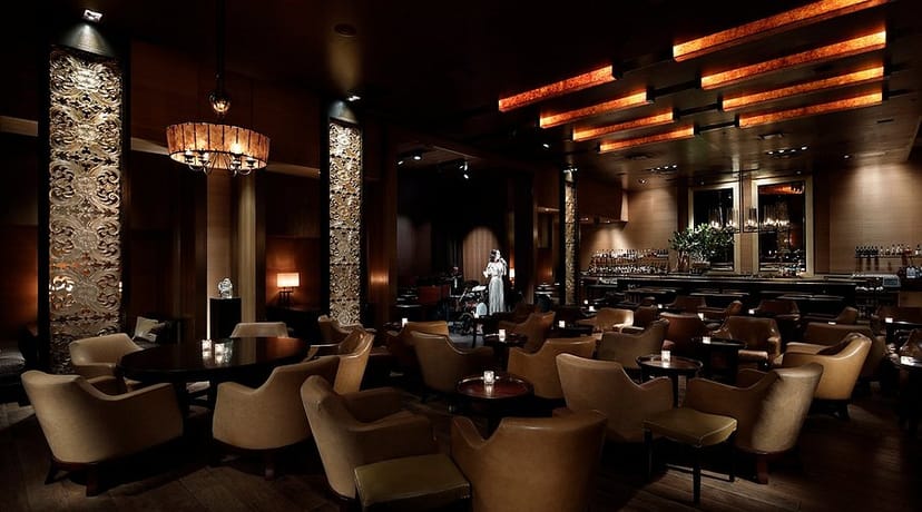 Sophisticated lounge with plush armchairs for VIP networking and executive event receptions.