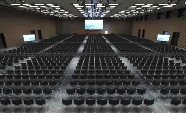 Tokyo convention hall ballroom with high-density theater seating for corporate event planning.
