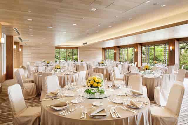Hilton Tokyo Bay banquet hall with natural light for corporate gala or wedding reception.