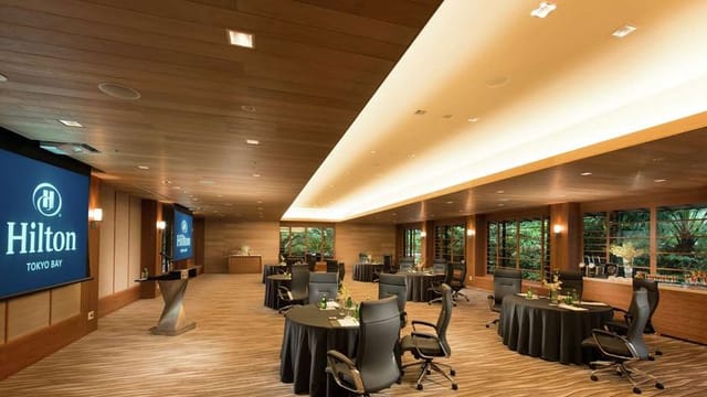Modern Hilton Tokyo Bay conference room with banquet seating for corporate workshops and seminars.