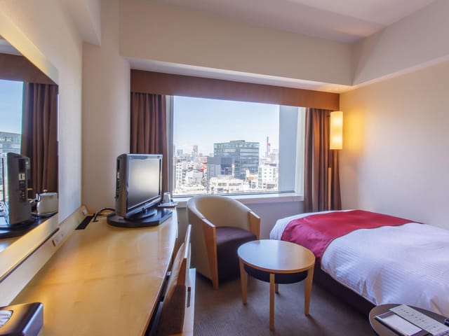Hotel Grand Arc Hanzomon room, business traveler workspace, corporate hotel booking, urban view.
