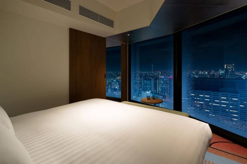 VIP suite at HOTEL GROOVE SHINJUKU with high-floor city views for executive conferences.